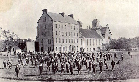 St. Bon's students on the campus field, early 1900s
